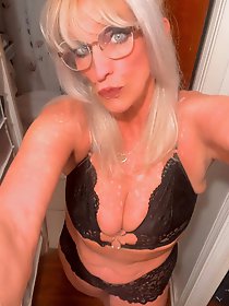 Half-naked explosive mature women posing.