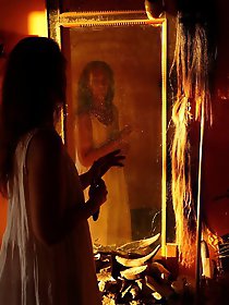 An amazing old lady is posing almost naked in stunning shots